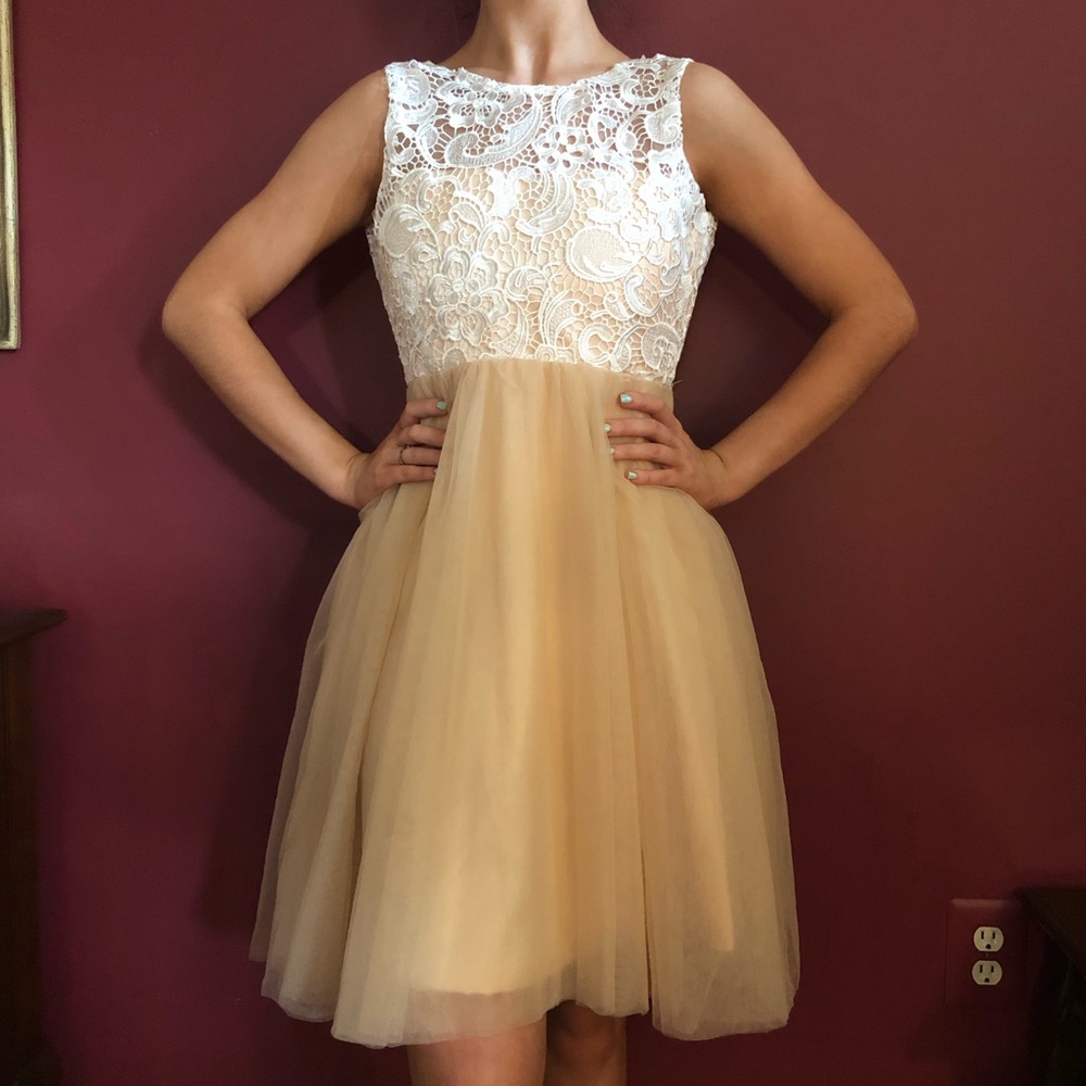 Woman’s cocktail champagne and lace dress